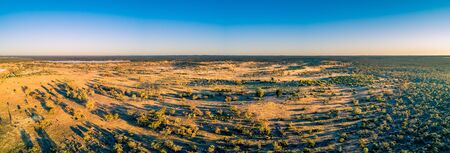 Wide aerial panorama of Australian outback at sunsetの写真素材