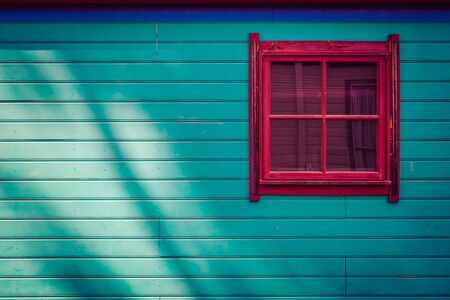 Square window on wooden cabin side with copy spaceの写真素材