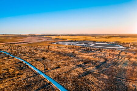 Aerial view of sunset over Australian desert and agricultural landの写真素材