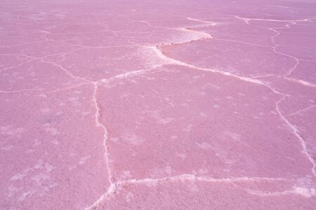 Closeup of windblown salt patterns of a pink lake in Australiaの写真素材