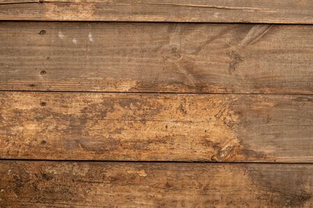 Decaying wooden planks with rusty screws background overlayの写真素材