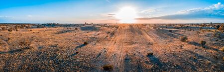 Sunrise over Australian desert - wide aerial panoramic landscapeの写真素材