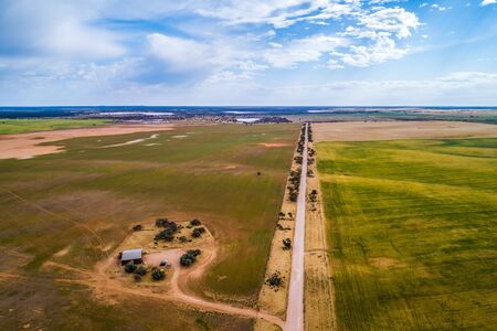 Road passing through agricultural landの写真素材