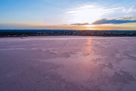 Aerial view of sunrise over pink salt lake Crosbie in Victoria, Australiaの写真素材