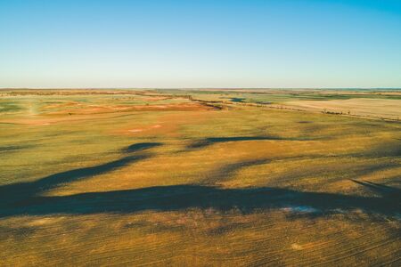 Pastures at sunset in Australia - aerial viewの写真素材