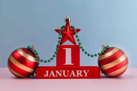 January 1st still life composition with Christmas decorations and copy space on clean pink blue backgroundの写真素材
