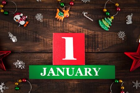 January 1st - new year concept with Christmas decorations on wooden backdrop extreme closeupの写真素材
