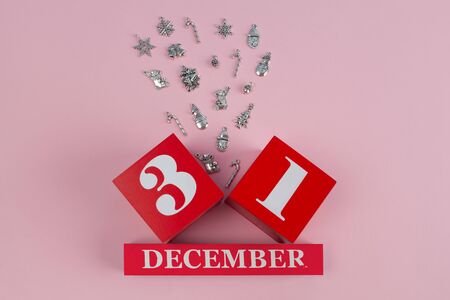 Christmas decorations bursting between red boxes on 31st of december with copy space - new year conceptの写真素材