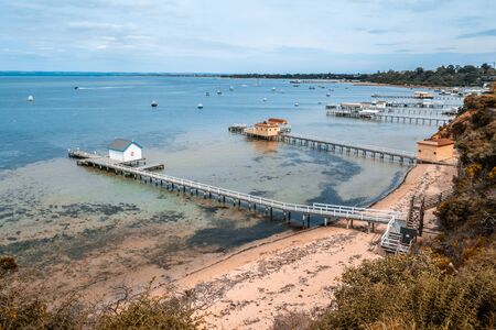Scenic Mornington Peninsula coastline with beautiful wooden piers and sheds. Sorrento, Victoria, Australiaの写真素材