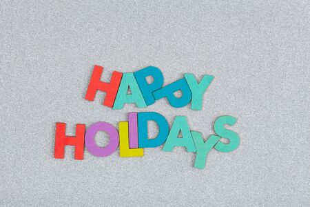 Happy Holidays text creatively arranged on glitter backgroundの写真素材