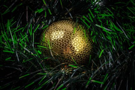 Extreme closeup of shiny gold Christmas baubleの写真素材
