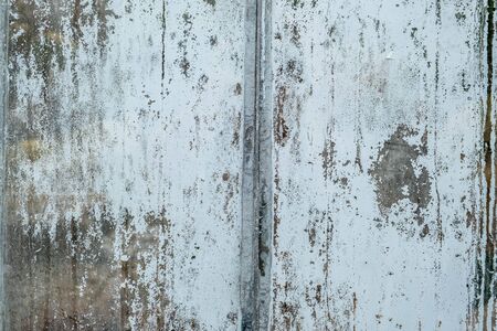 Old white paint peeling off glass overlayの写真素材