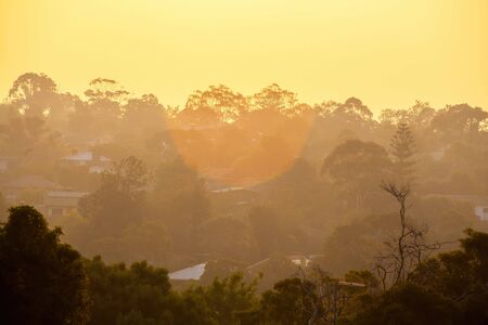 Smoke haze covering houses in the Greater Melbourne area as result of bush fires in Victoriaの写真素材