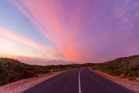 Beautiful glowing sunset ver scenic coastal road in Australiaの写真素材