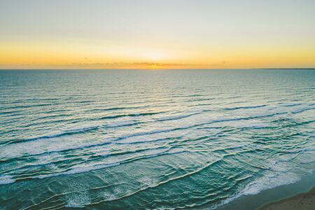 Minimal sunset seascape over ocean with copy space