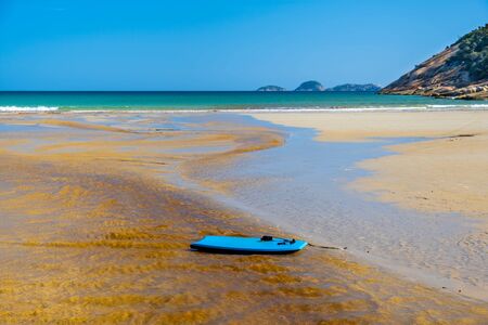 Boogie board drifting on Tidal River waters into the ocean at Norman Beach. Wilsons Prom, Australiaの写真素材