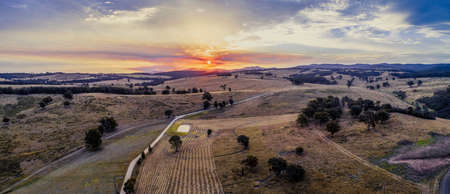 Aerial panorama of sunset over fields and hills in Australiaの写真素材