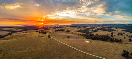 Vivid sunset in Australian outback - aerial panoramaの写真素材