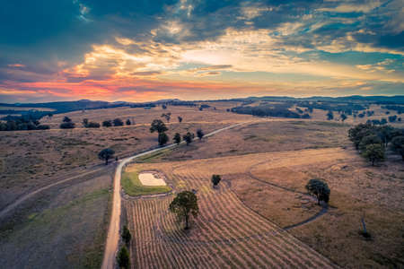 Beautiful sunset over fields - aerial viewの写真素材