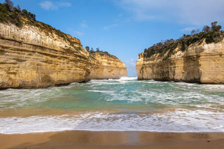 Loch Ard Gorge beach and strong ocean waves on Great Ocean Road in Australiaの写真素材
