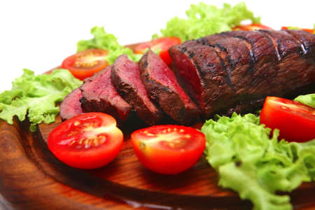 roast beef red meat on wooden plateの写真素材