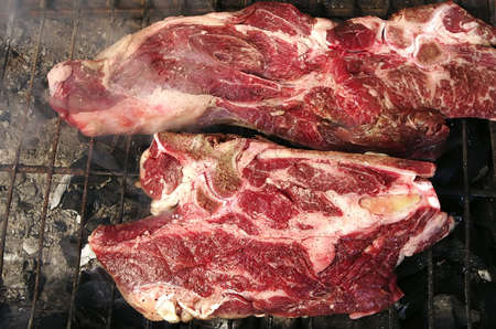 raw meat steack on gridの写真素材