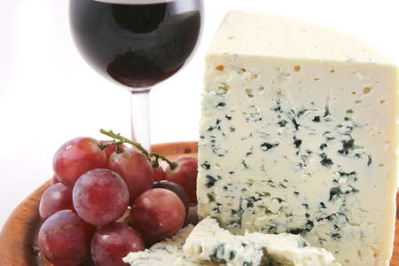 roquefort cheese and grapes  with red wine glassの写真素材