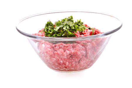 mince meet inside transparent bowl over whiteの写真素材