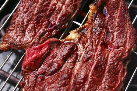 well done hot roast steak on electrical brazierの写真素材