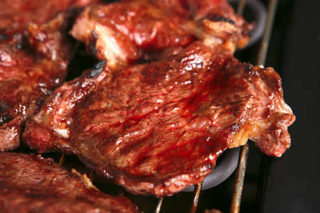 bloody ripe meat steak on bbq gridの写真素材