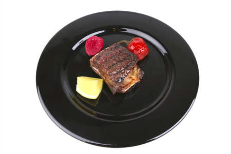 roast rib's on black dish over whiteの写真素材