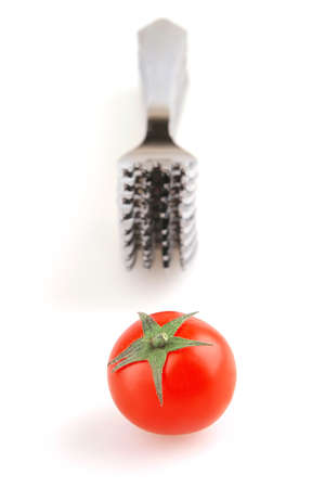 forks and single tomatoの写真素材