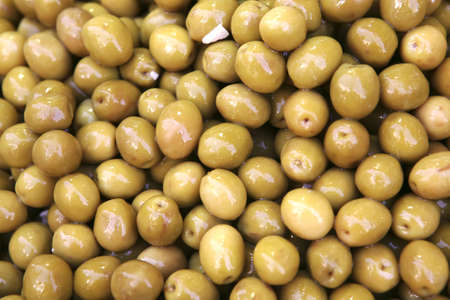 olives heap on open market as backgroundの写真素材