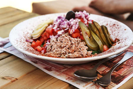 greece salad served on big white dishの写真素材