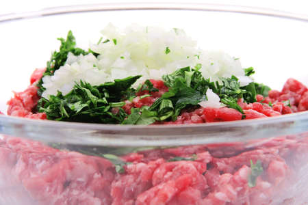 minced meat inside big transparent bowl side viewの写真素材