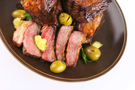 rib's and olives close up with green olivesの写真素材