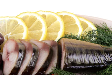 smoked fish back close up with fennel and lemonの写真素材