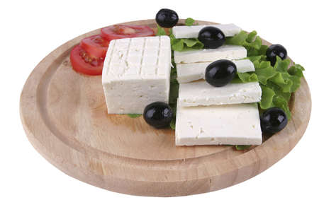 white cheese with olives and tomato on woodの写真素材