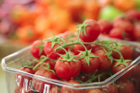 cherry tomato heap on open market as background