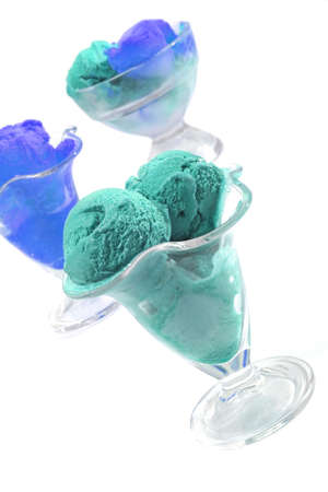 lemon and chocolate ice cream in glass over whiteの写真素材