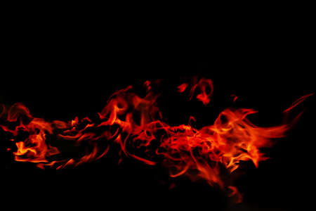 red wild fire on black backgroundの写真素材