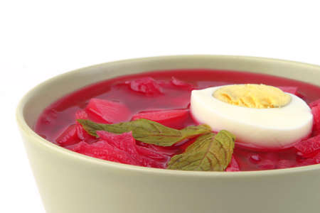 fresh beet vegetable soup in green bowl