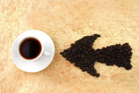 arrow of coffee beans on grunge backgroundの写真素材