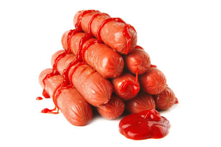 pyramide of sausages with ketchup over white backgroundの写真素材
