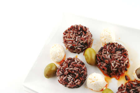 mozarella cheese and dark rice served on plateの写真素材