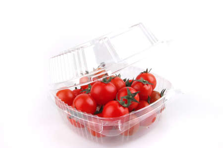 tomato cherry in open box over white backgroundの写真素材
