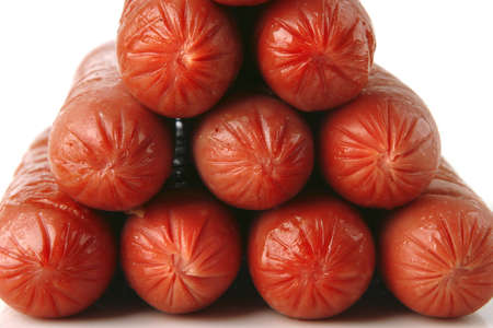 pyramide of grilled beef sausages over white backgroundの写真素材