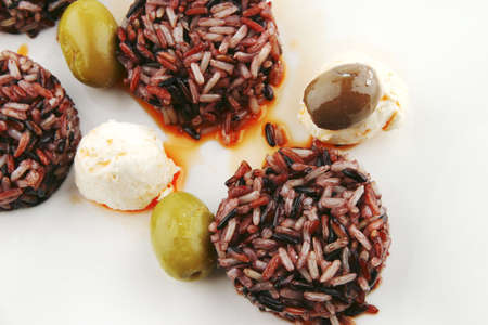 mozarella cheese and dark rice served on plateの写真素材