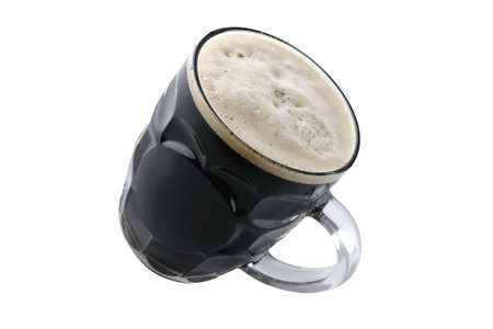 dark beer in big glass isolated over whiteの写真素材