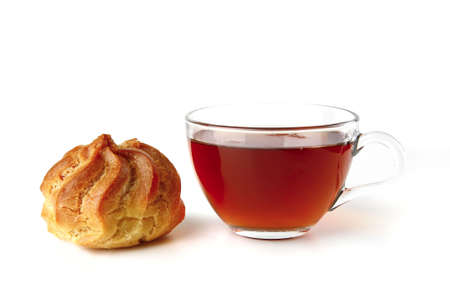 tea and eclair served on white backgroundの写真素材